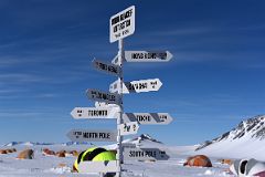 02B Sign Showing Distance From Union Glacier Antarctica To Hong Kong, Punta Arenas, Shanghai, Los Angeles, Toronto, Tokyo, Sydney, North Pole, South Pole.jpg